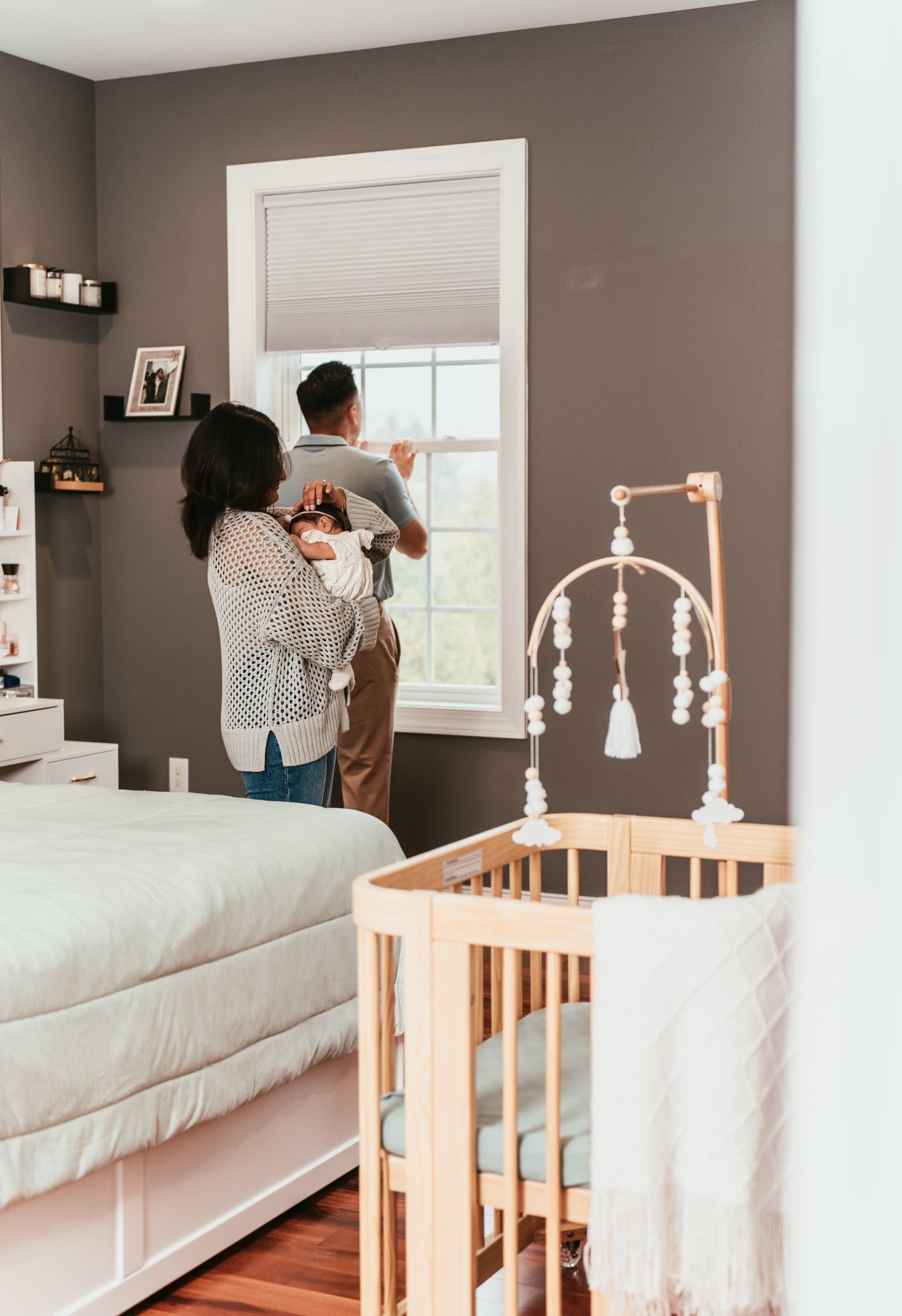 Tender close-up of father cradling his sleeping newborn daughter against his chest
