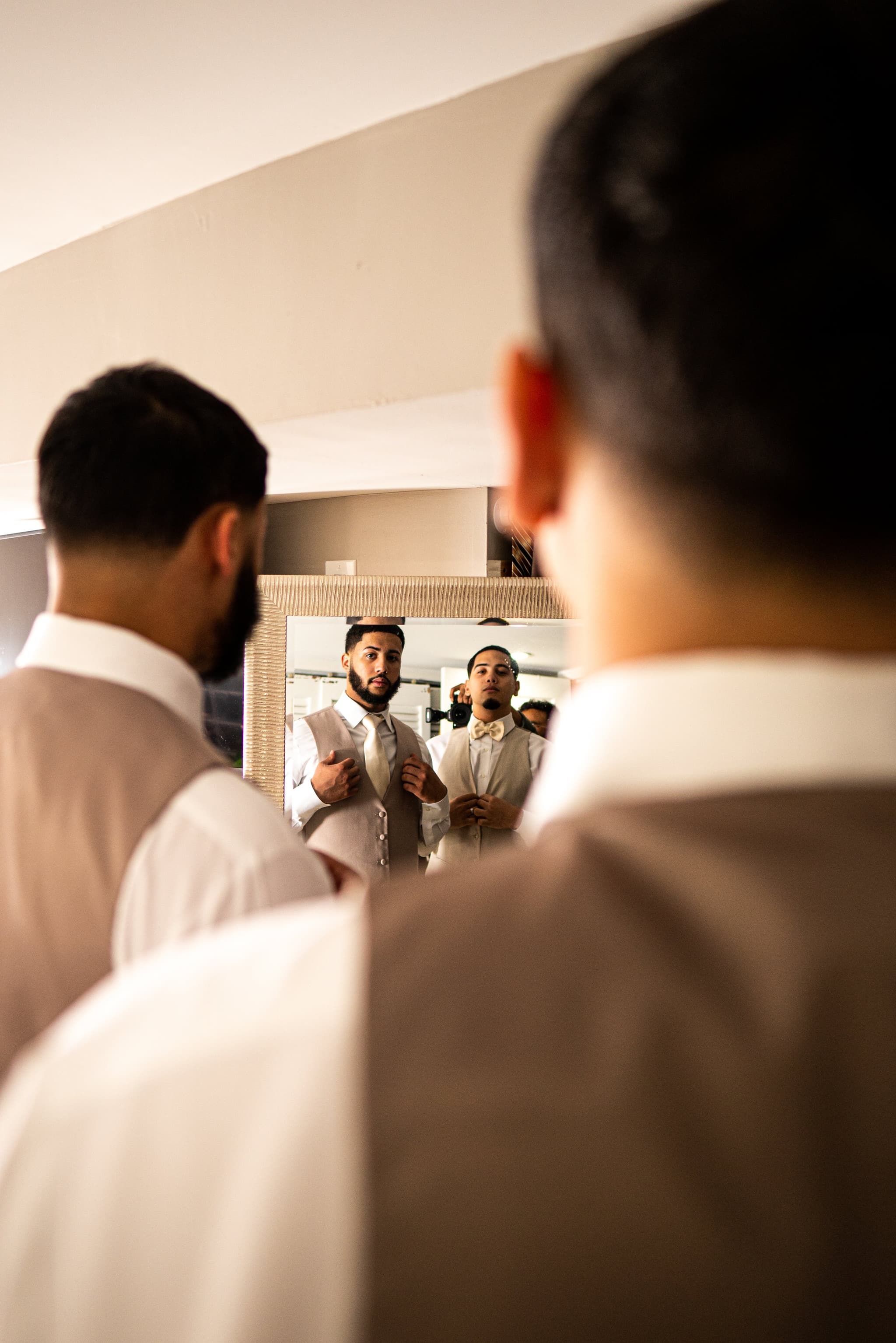Groomsmen getting ready — creative mirror reflection shot